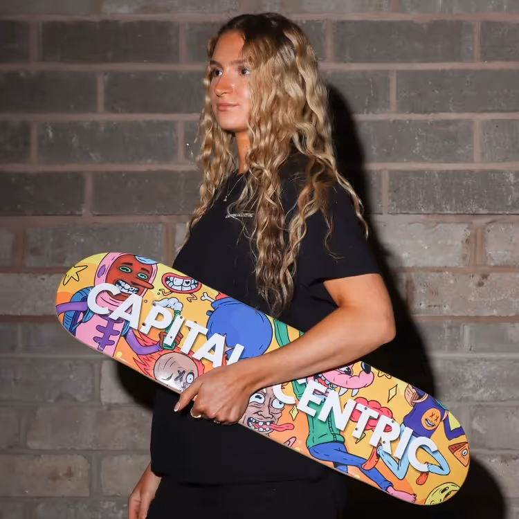 Woman carrying skateboard